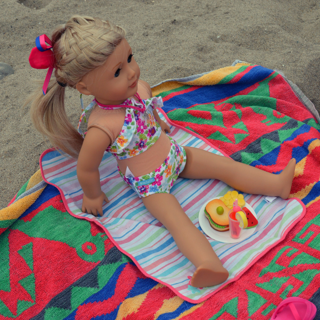 american girl doll on the beach